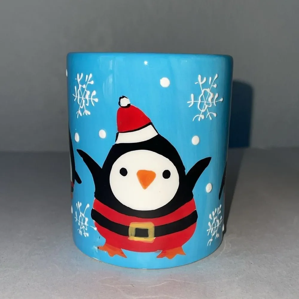 Pier 1 Penguin in Santa Outfit Blue Coffee Mug.